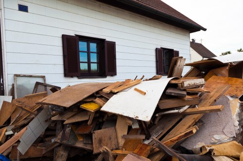 Workers managing demolition waste responsibly