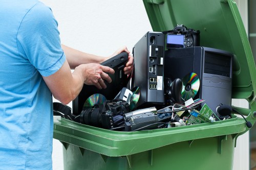Clearance team efficiently removing office items with care