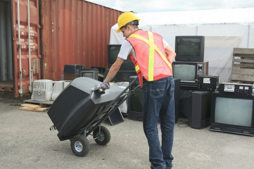 Worker wearing high-visibility PPE inspecting equipment